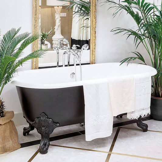 White clawfoot bathtub in porcelain enameled cast iron with roll top and wall-mounted faucets