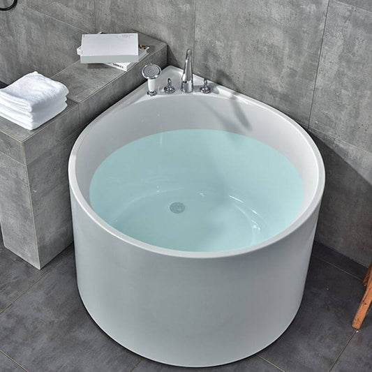 White acrylic corner soaking bathtub with slip-resistant surface, deck faucets, and built-in seat main product image