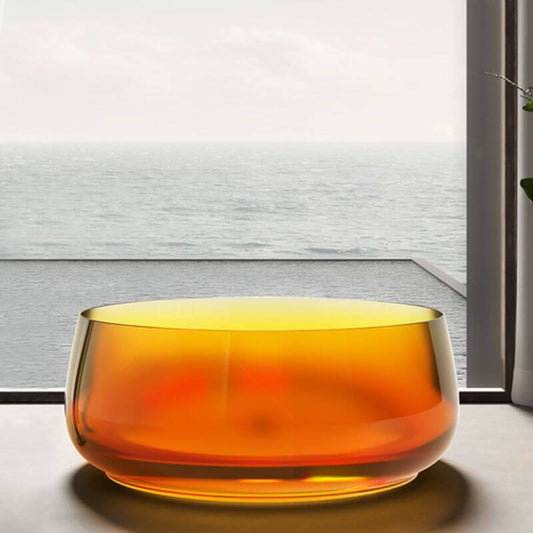 Freestanding circular resin bathtub with roll top design for casual soaking