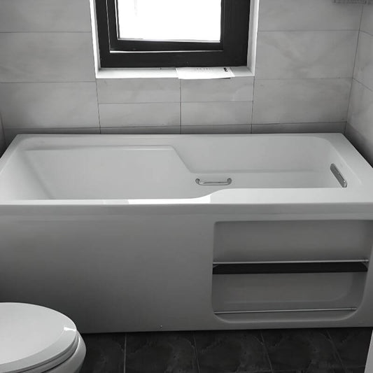 White freestanding Lucite rectangle bathtub designed for back-to-wall soaking