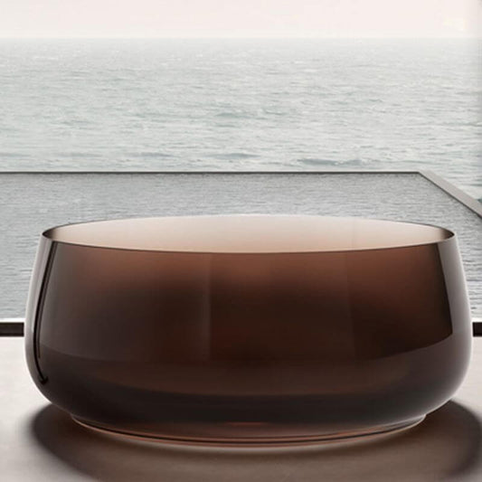 Freestanding circular resin bathtub with roll top design for casual soaking