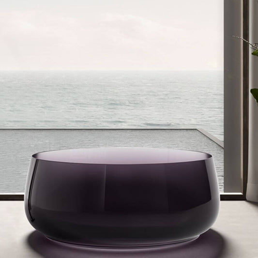 Freestanding circular resin bathtub with roll top design for casual soaking