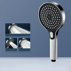 Silver round handheld shower head featuring adjustable sprays