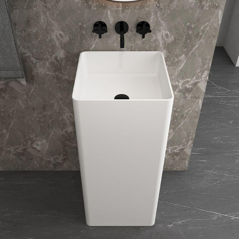 Close-up of Bright White Ceramic Pedestal Bathroom Sink