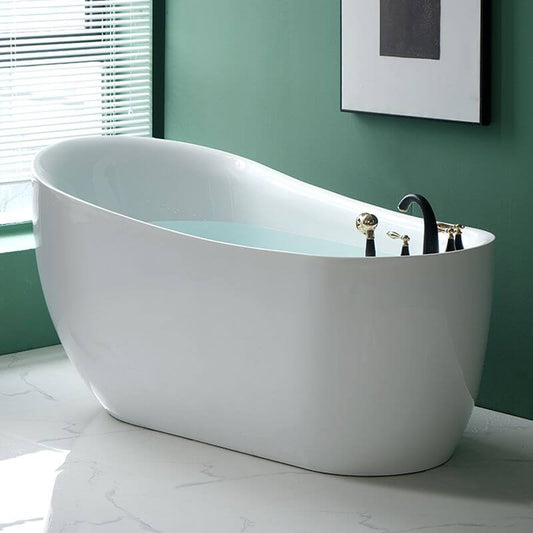 White oval freestanding bathtub against wall