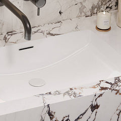 Stylish white sink on black vanity