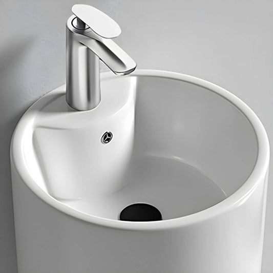 Freestanding bathroom sink with faucet hole