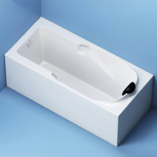 Alcove bathtub next to decorative tiles