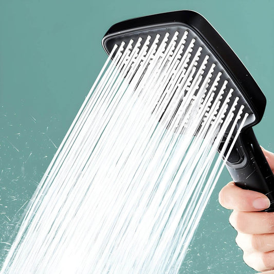 Elegant silver handheld shower head in a modern bathroom