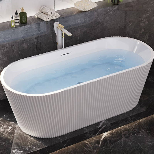 White oval freestanding bathtub in modern bathroom