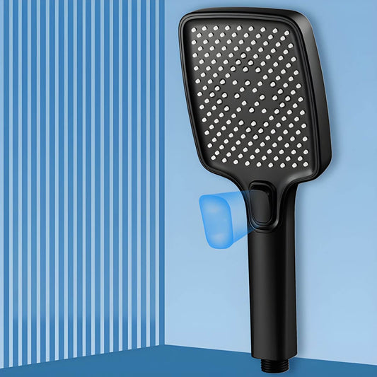 Black handheld shower head in modern bathroom