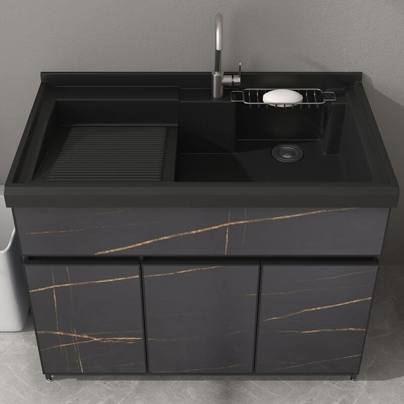 Free-standing bathroom vanity with black stone countertop