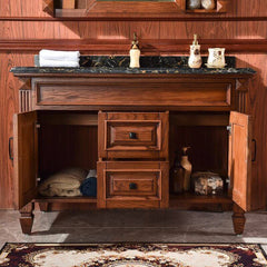 wood bathroom vanity with black stone countertop