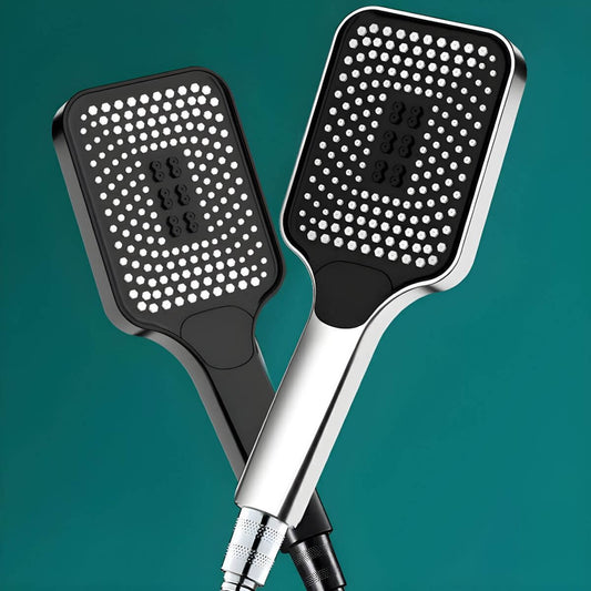 Close-up of a handheld shower head with full spray pattern