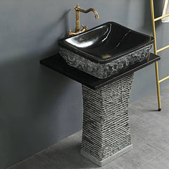 pedestal sink with black marble finish