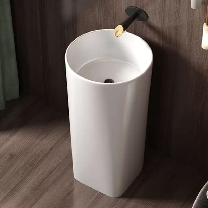 Pedestal sink showcasing pop-up drain