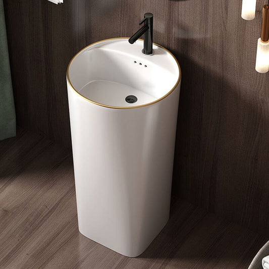 Pedestal sink showcasing pop-up drain