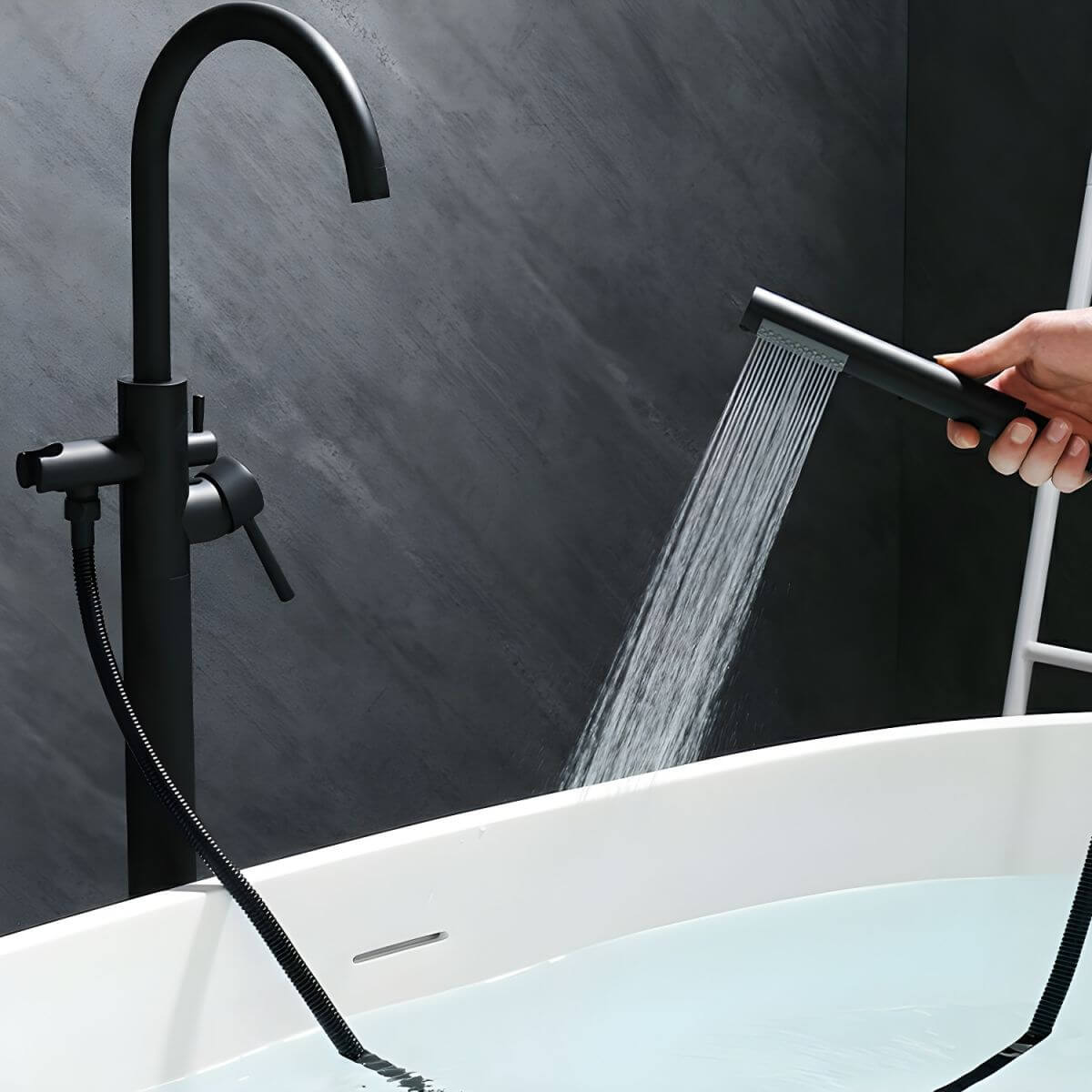 Free standing bathtub faucet with hand shower