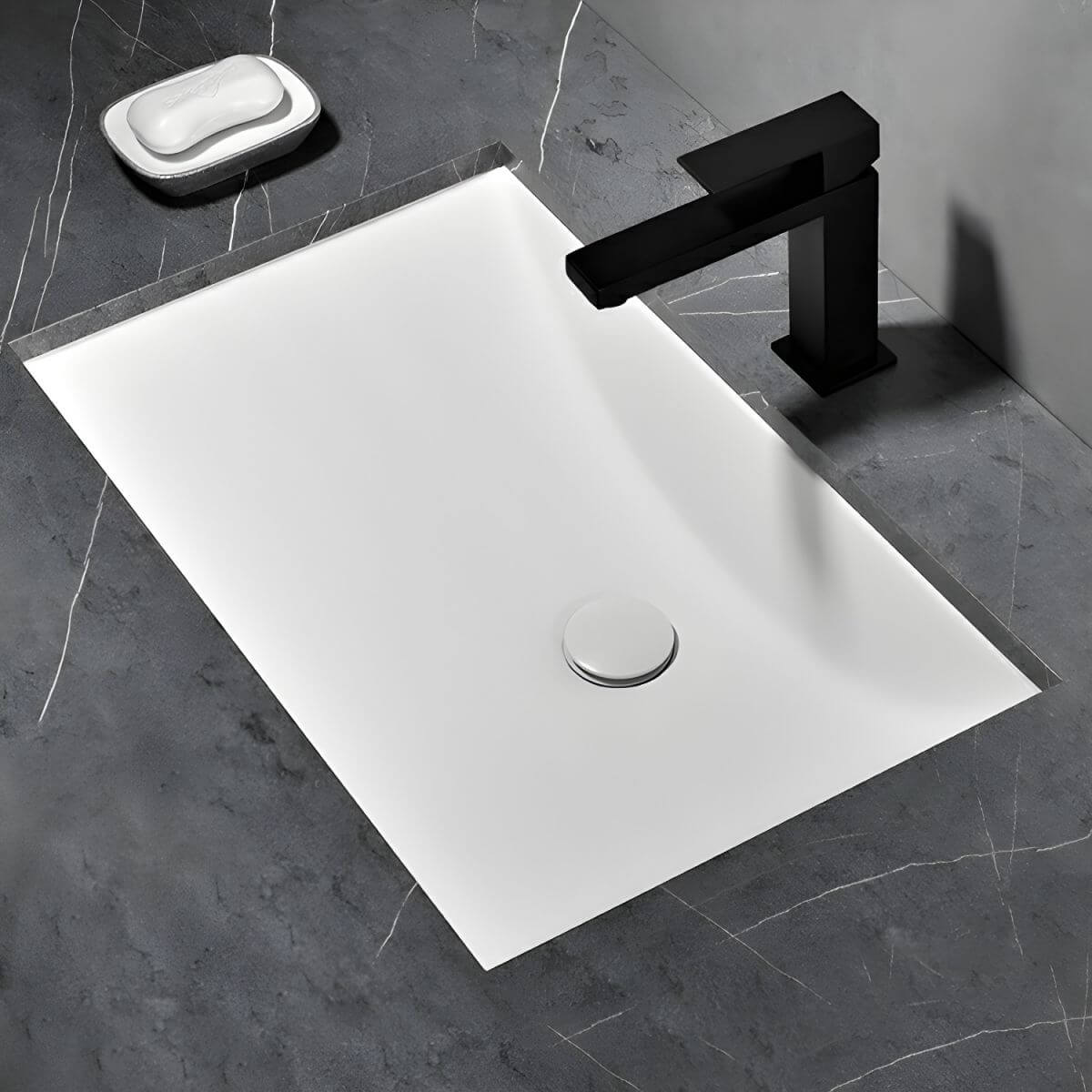 Undermount ceramic sink with pop-up drain feature