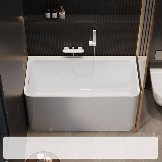 White rectangle back-to-wall freestanding bathtub with valve and compression faucet