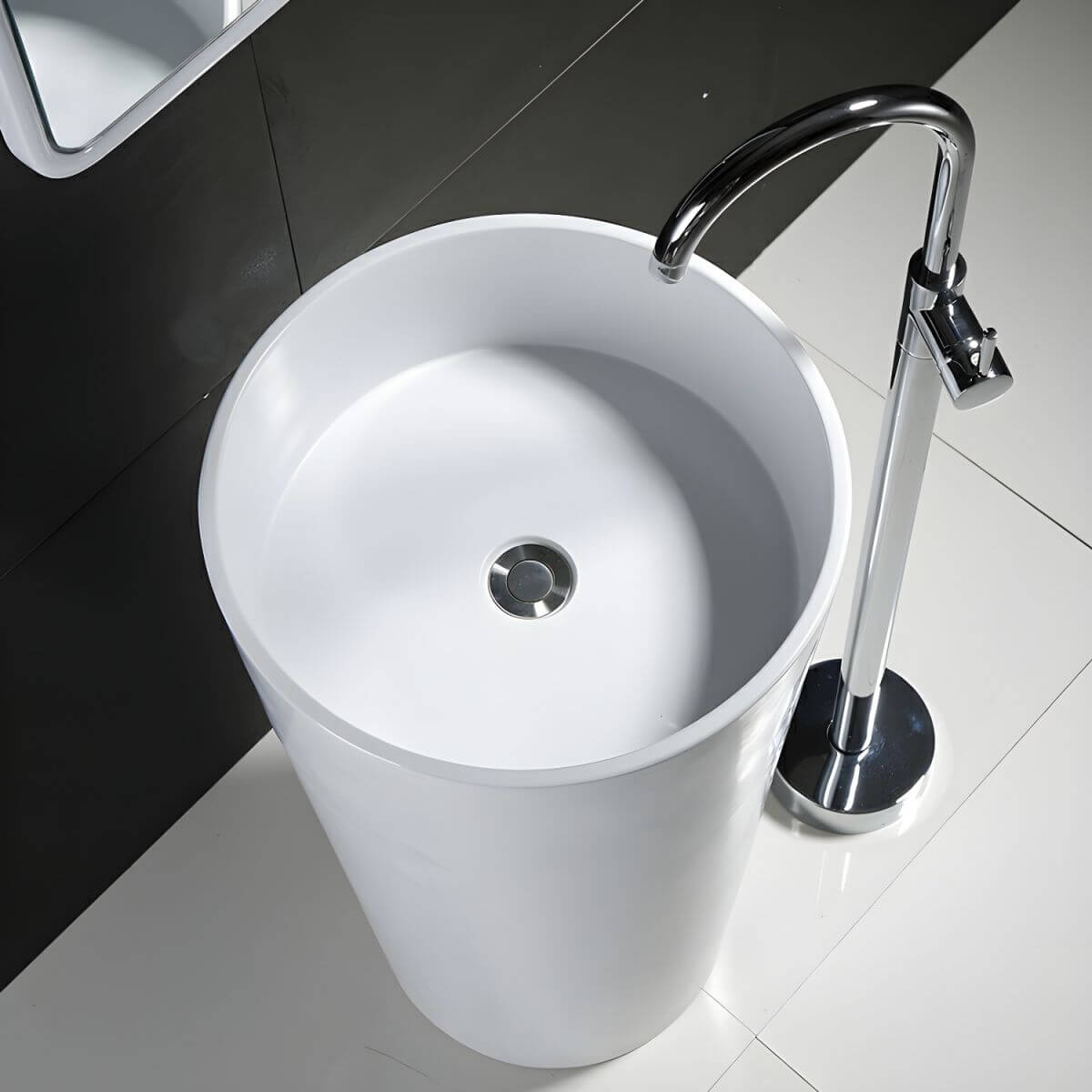 pedestal sink against modern wall