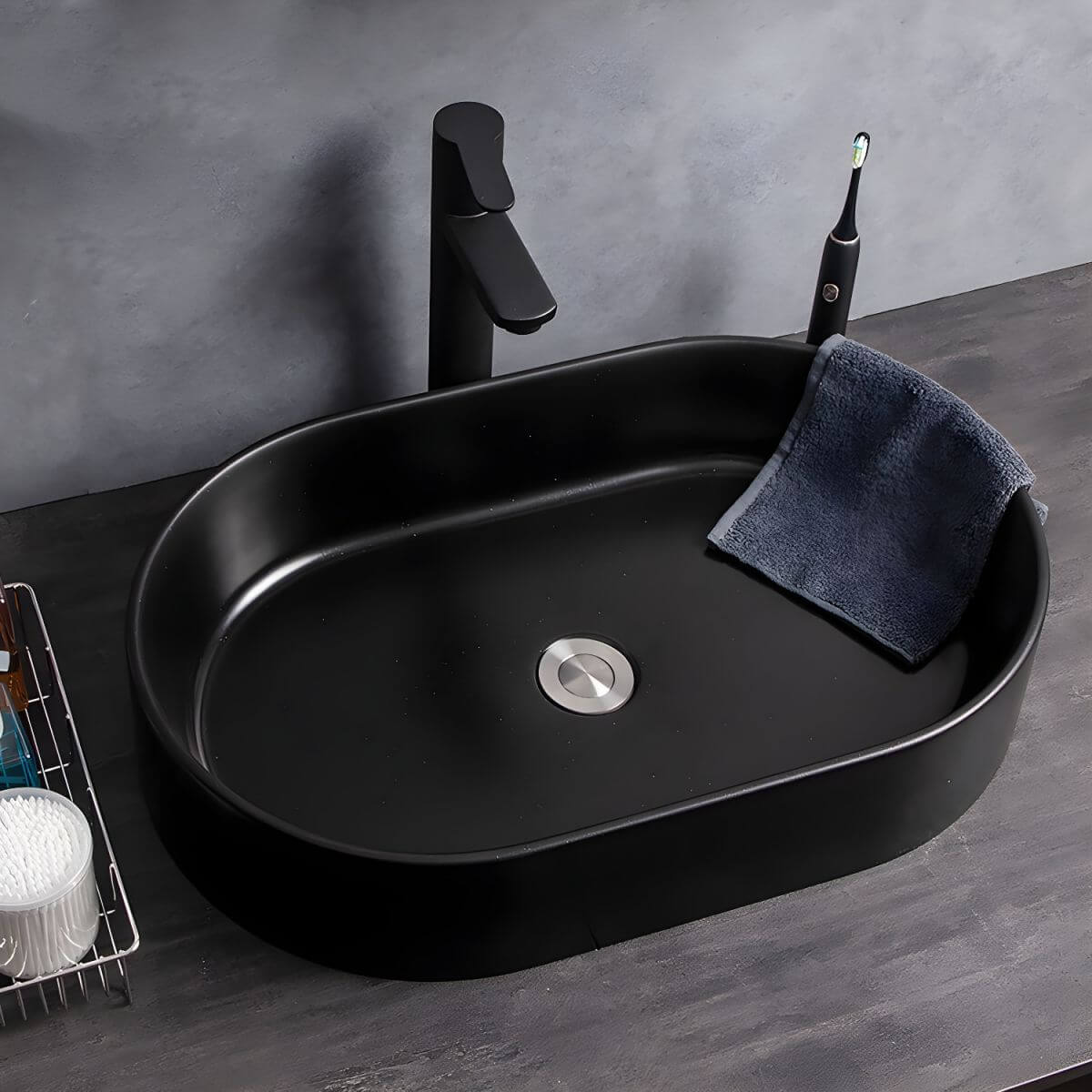 Oval engineered stone vessel sink in white