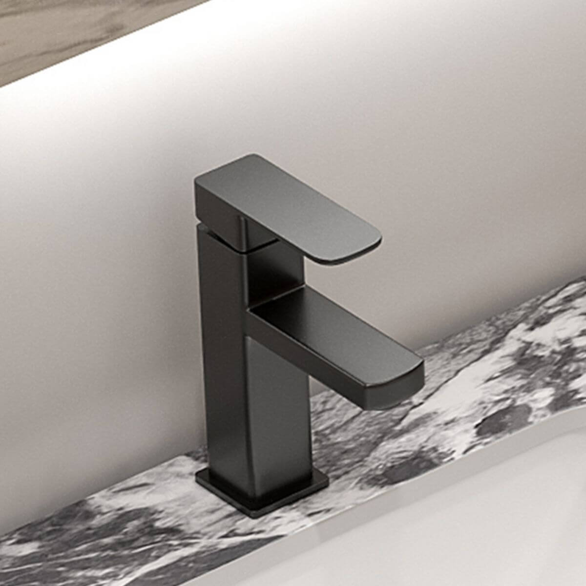 Close-up of black and white stone bathroom sink