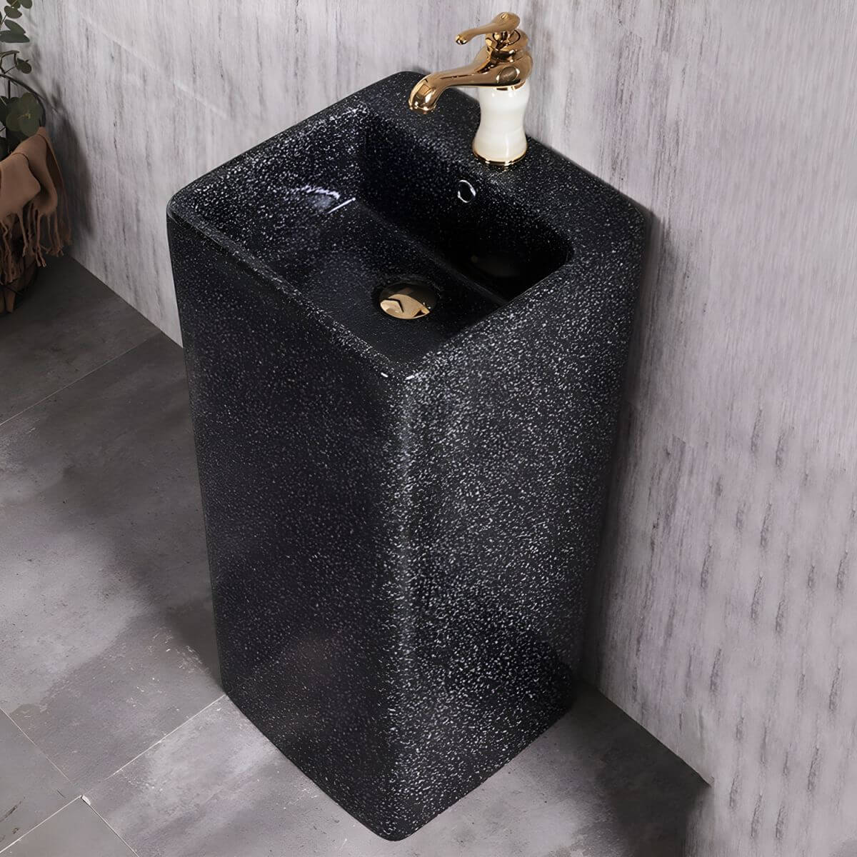 Grey marble pedestal sink with overflow feature