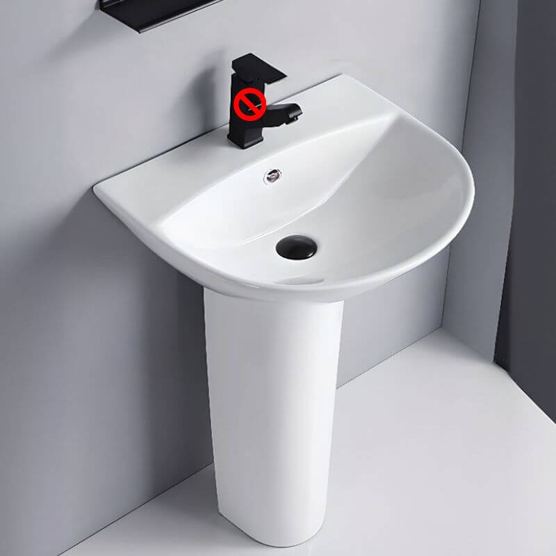 White ceramic U-shaped pedestal sink in modern bathroom