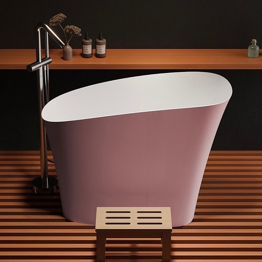 Stylish pink synthetic stone bathtub, 47 inches in length, showcasing a deep soak design perfect for modern bathrooms.