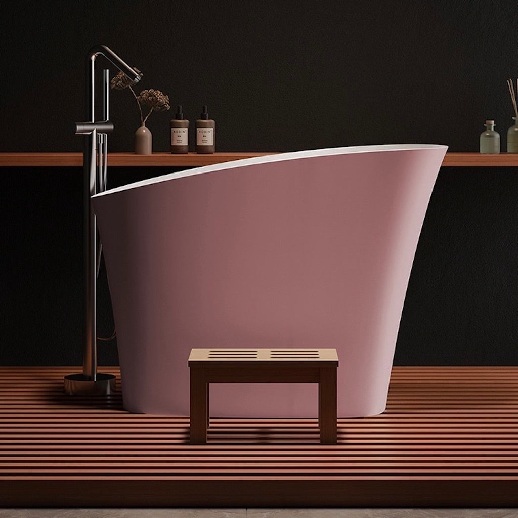 Elegant 47-inch oval pink bathtub made from innovative synthetic stone for a luxurious single soak experience.