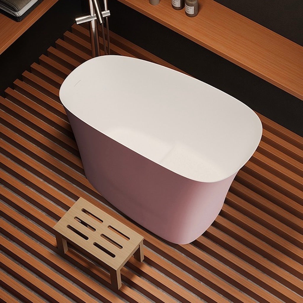 Eco-friendly and durable 47-inch oval bathtub in pink, crafted from new synthetic stone for a comfortable, single-person soaking.