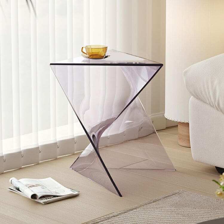 An abstract X-base acrylic triangle side table, showcasing a modern short accent table design with thick, clear acrylic, ideal for contemporary interiors.