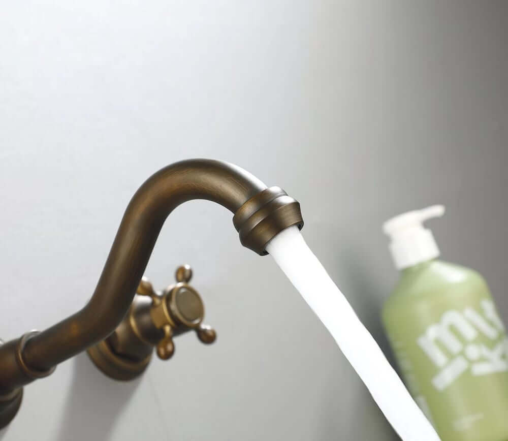 Chester Collection Wall Mount Bathroom Faucet in Antique Brass