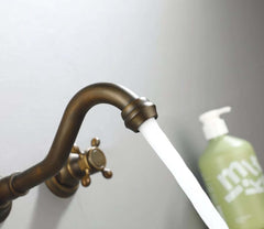 Chester Collection Wall Mount Bathroom Faucet in Antique Brass