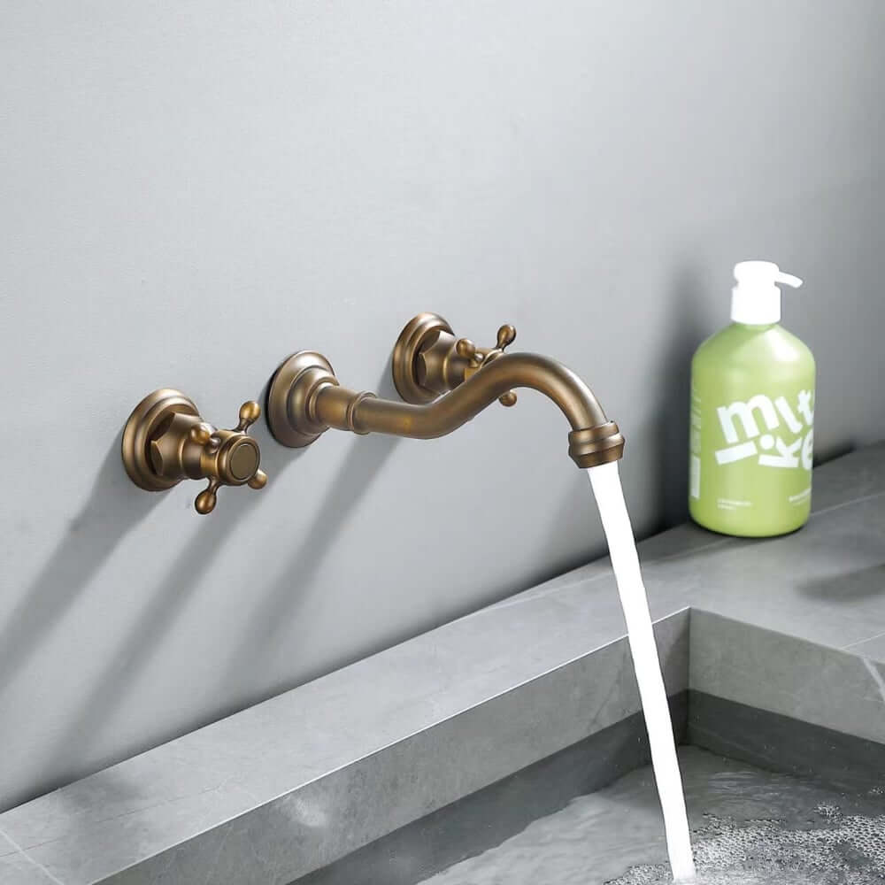 Chester Collection Wall Mount Bathroom Faucet in Antique Brass