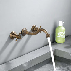Chester Collection Wall Mount Bathroom Faucet in Antique Brass