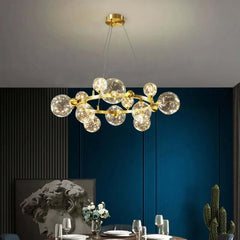 Gold 12-Light Globe Chandelier with Clear Glass Shades - Modern Elegance Main Product Image