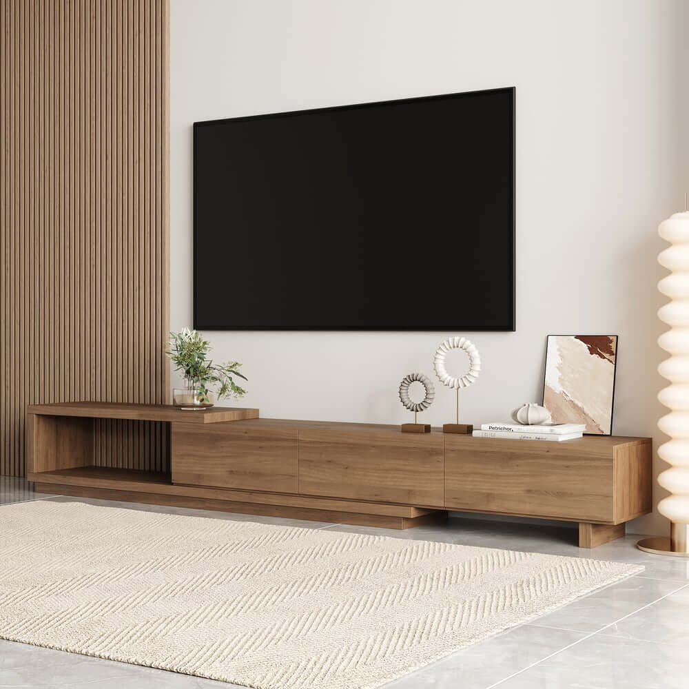 A modern living room featuring a perfectly sized media console beneath a large television, demonstrating ideal width and height proportions.