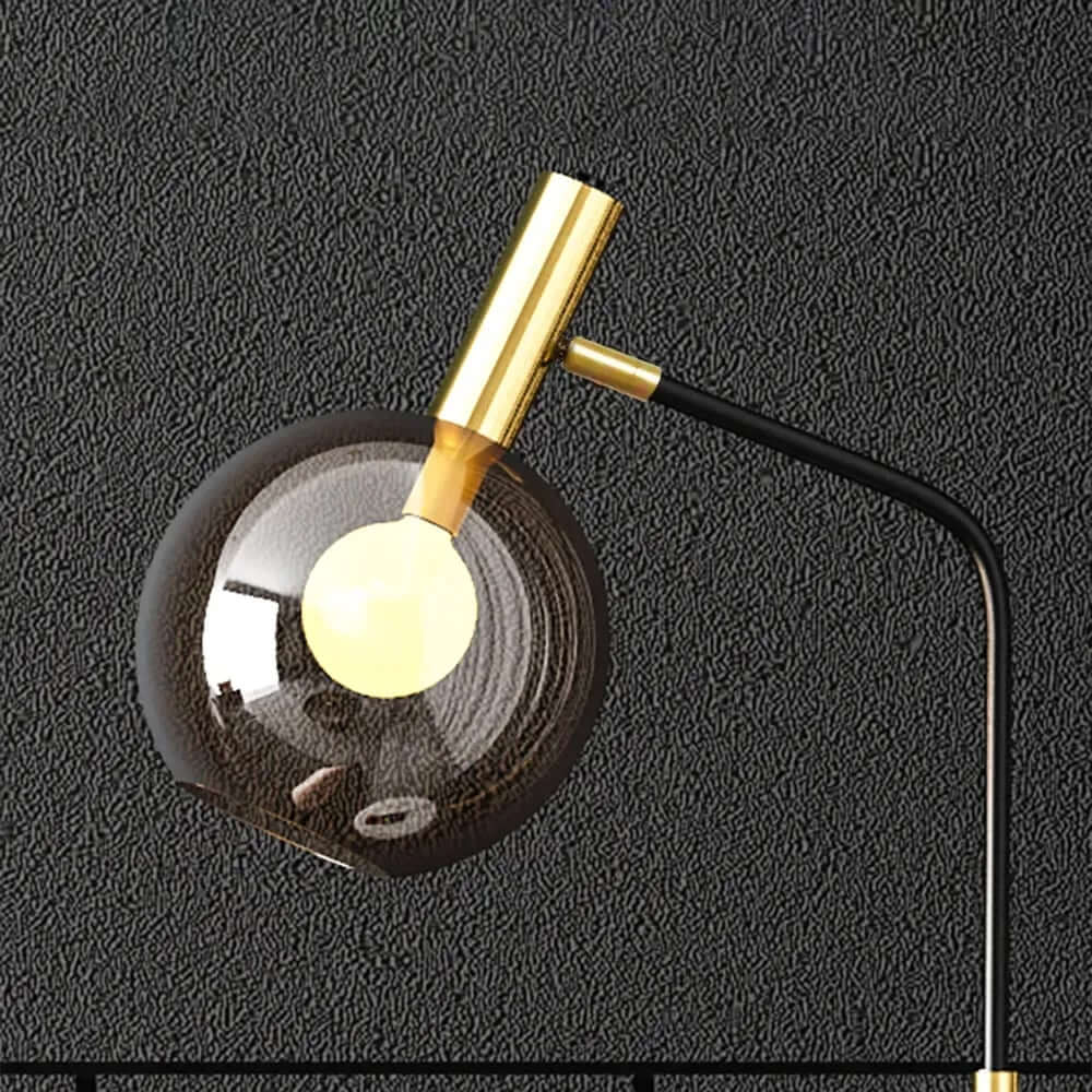 Modern Black and Gold Floor Lamp with Amber Glass Shade