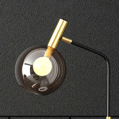 Modern Black and Gold Floor Lamp with Amber Glass Shade