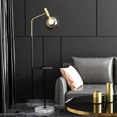 Modern Black and Gold Floor Lamp with Amber Glass Shade