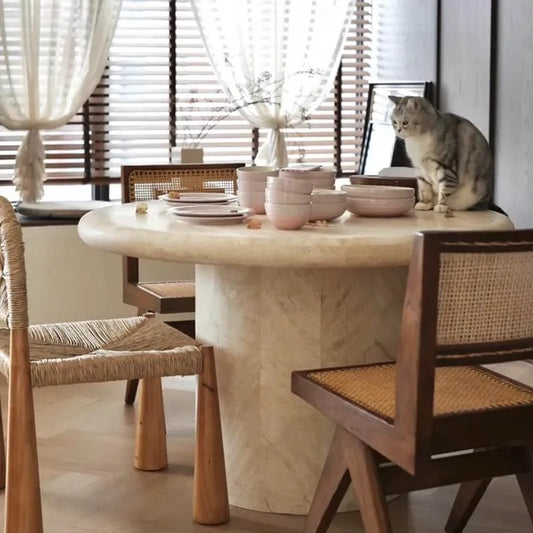Sculptural Round Travertine Dining Table in Warm Beige, Spacious Pedestal Design