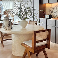 Sculptural Round Travertine Dining Table in Warm Beige, Spacious Pedestal Design