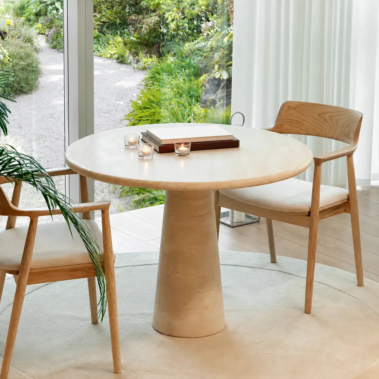 Sculptural Round Travertine Dining Table with Easy-Care Stone Look