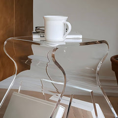 Ultra-Modern Clear Side Table with Integrated Book Holder